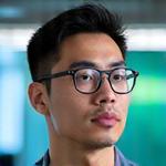 Professional headshot of Dr. Kenji Tanaka, CTO of GoMo, looking thoughtfully.