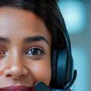 Customer support agent answering a phone call with a headset